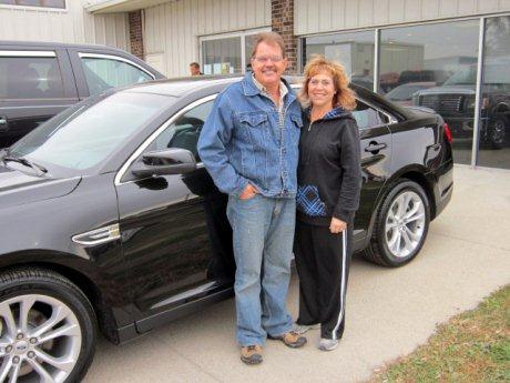  Myron and Kristi P. and their 2013 Ford Taurus.